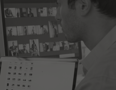 Man in front of computer screens